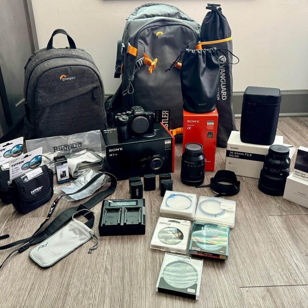 Sony A7R4 Mirrorless Digital Camera Body with 2 lenses, filters, and backpacks